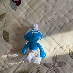 Blue Robot Smurf Figure Toy with White Hat and Pants